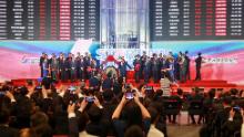 People take pictures during an opening ceremony of the Shanghai Stock Exchange's Sci-Tech Innovation Board in Shanghai on July 22, 2019. - Trading begins on July 22 on a new Nasdaq-style technology board in Shanghai that represents one of China's most significant market reforms, and a potential weapon in its growing tech rivalry with the United States. Twenty-five stocks debuted on the Shanghai Stocks Exchange's Sci-Tech Innovation Board -- dubbed the STAR Market -- in which listing and trading rules have been eased to help channel funding to start-ups. (Photo by STR / AFP) / China OUT        (Photo credit should read STR/AFP/Getty Images)