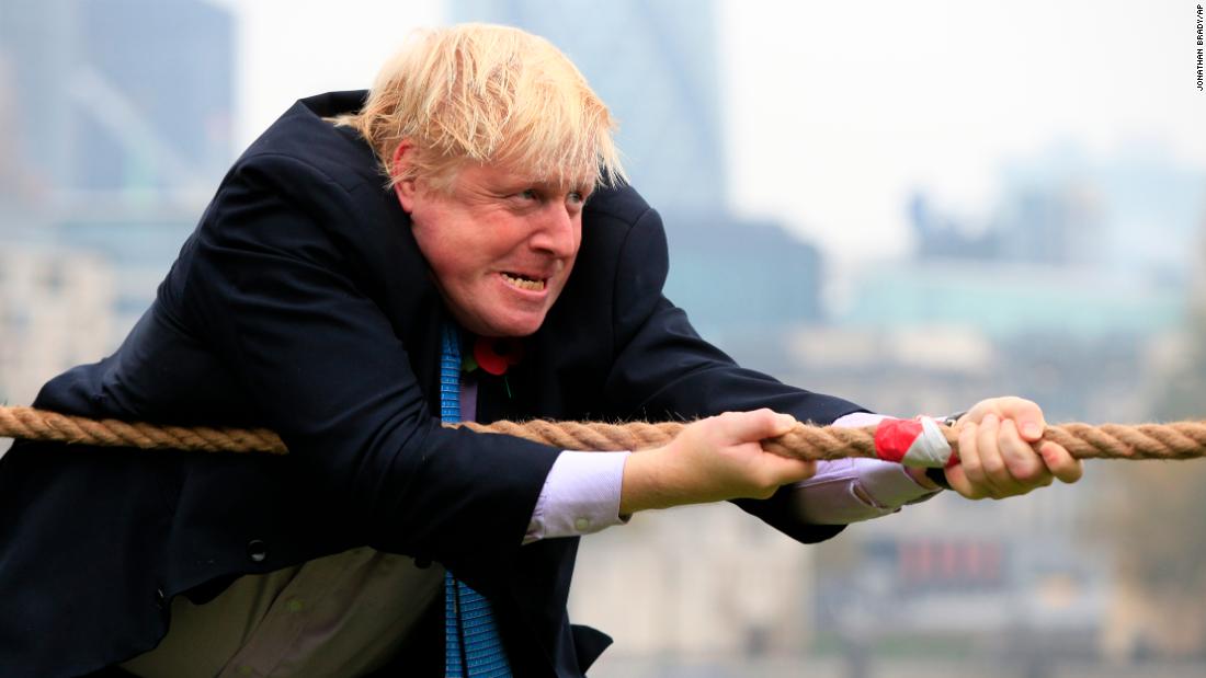 Johnson takes part in a charity tug-of-war  with British military personnel in October 2015.