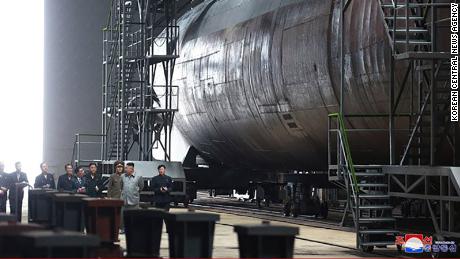 Kim is seen alongside what appears to be a sub in this image released by North Korean state media Tuesday.