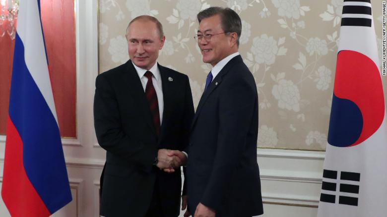 Russian President Vladimir Putin and South Korea&#39;s President Moon Jae-in hold a bilateral meeting on the sidelines of the G20 summit in Osaka on June 28.