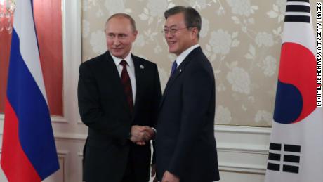 Russian President Vladimir Putin and South Korea&#39;s President Moon Jae-in hold a bilateral meeting on the sidelines of the G20 summit in Osaka on June 28.