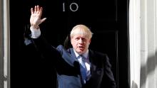 Britain's new Prime Minister, Boris Johnson, waves from the steps of No. 10 Downing Street after giving a statement in London on July 24.