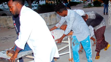 Medical workers help a civilian who was wounded in a suicide bombing in Mogadishu, Somalia, on Wednesday.