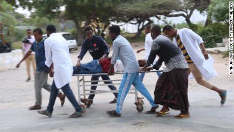 People carry a wounded person on a stretcher after a suicide attack in Mogadishu on Wednesday.