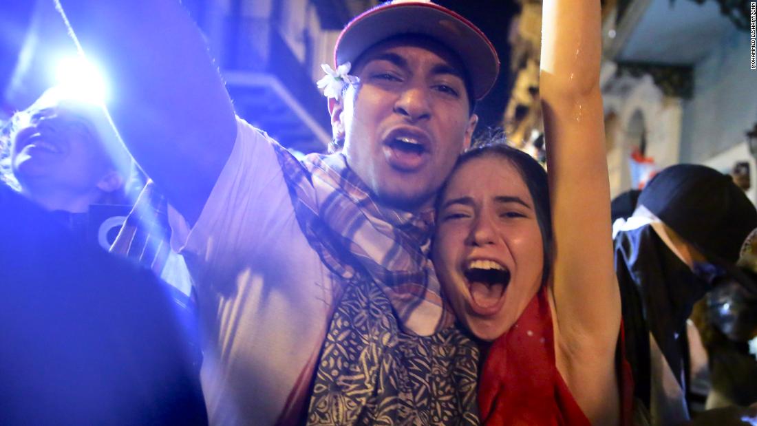 Demonstrators react in front of the governor&#39;s mansion, known as La Fortaleza.