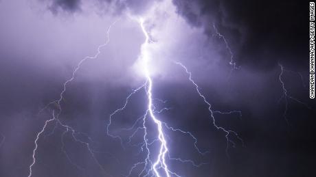 TOPSHOT - Lightning strikes during an electrical storm over Port-au-Prince on June 25, 2019. (Photo by CHANDAN KHANNA / AFP)        (Photo credit should read CHANDAN KHANNA/AFP/Getty Images)