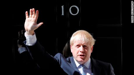 Britain&#39;s new Prime Minister Boris Johnson waves from the steps outside 10 Downing Street, London, Wednesday, July 24, 2019. Boris Johnson has replaced Theresa May as Prime Minister, following her resignation last month after Parliament repeatedly rejected the Brexit withdrawal agreement she struck with the European Union. (AP Photo/Frank Augstein)