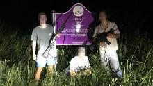 This photo, obtained by ProPublica, shows three University of Mississippi students in front of a roadside plaque commemorating Emmett Till. The faces in this image were obscured by CNN because it has not been able to reach the individuals for comment. 