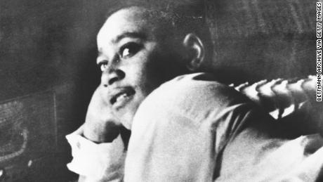 Emmett Till is shown lying on his bed.