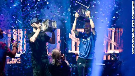 Jul 26, 2019; Flushing, NY, USA; RL Grime (left) and Airwaks (right) celebrate after winning the Pro-AM during the Fortnite World Cup Finals e-sports event at Arthur Ashe Stadium. Mandatory Credit: Catalina Fragoso-USA TODAY Sports