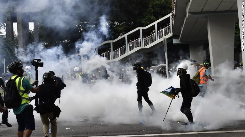 Hong Kong police fire tear gas during demonstration in the district of Yuen Long in Hong Kong on July 27, 2019. 