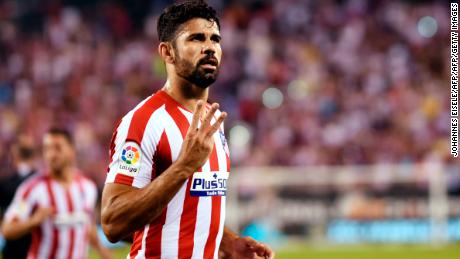 Atletico Madrid&#39;s Diego Costa celebrates after scoring his third goal.