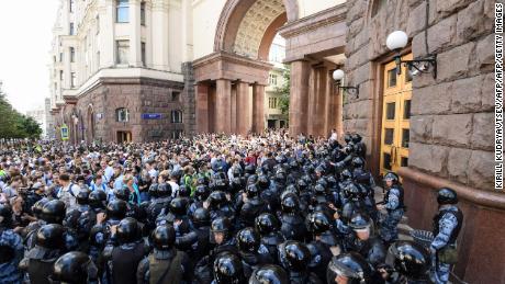 Protesters confront riot police in downtown Moscow on July 27.
