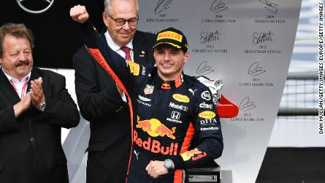 Race winner Max Verstappen celebrates on the podium after claiming the German Grand Prix at Hockenheim.