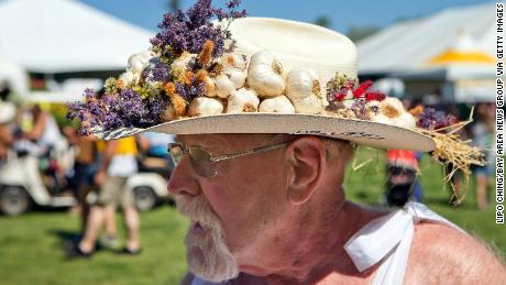Gerry Foisy wears a hat adorned with garlic cloves at the Gilroy Garlic Festival in 2014.