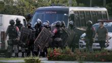Brazilian riot police prepare to invade the Puraquequara Prison facility at Bela Vista community, Puraquequara neighborhood at the city of Manaus, Amazonas state on May 27, 2019. - At least 40 inmates were killed in four jails in northern Brazil on Monday, authorities said, in the latest wave of violence to rock the country's severely overpopulated and dangerous prison system. (Photo by Sandro Pereira / AFP)        (Photo credit should read SANDRO PEREIRA/AFP/Getty Images)