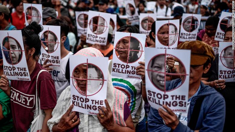 Protesters in the Philippines call on President Rodrigo Duterte to end extrajudicial killings.
