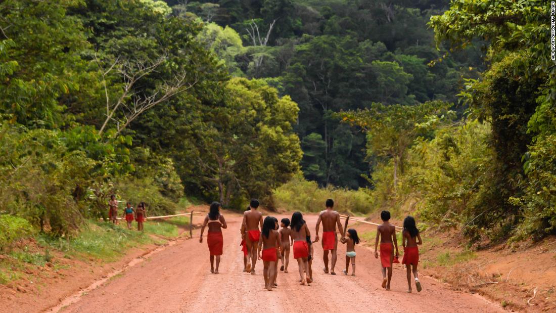 Brazilian Waiapi walk on the road of the Waiapi indigenous reserve, at Pinoty village in Amapa state in Brazil.