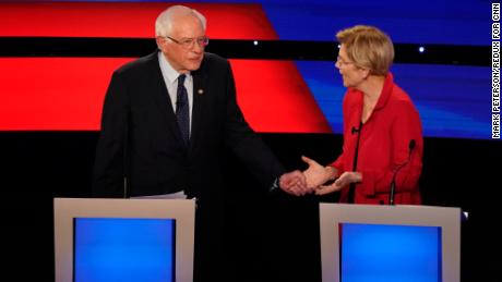 Democratic presidential candidates Bernie Sanders and Elizabeth Warren are seen onstage at the Democratic presidential debate hosted by CNN at the Fox Theater in Detroit on Tuesday, July 30.