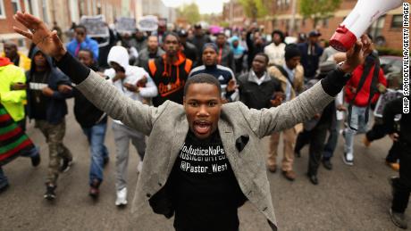 Demonstrators march toward a West Baltimore police station during a protest after the death of Freddie Gray in April 2015.