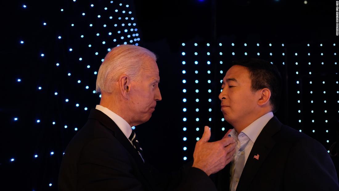 Yang and former Vice President Joe Biden talk backstage at the CNN Democratic debates in July 2019.