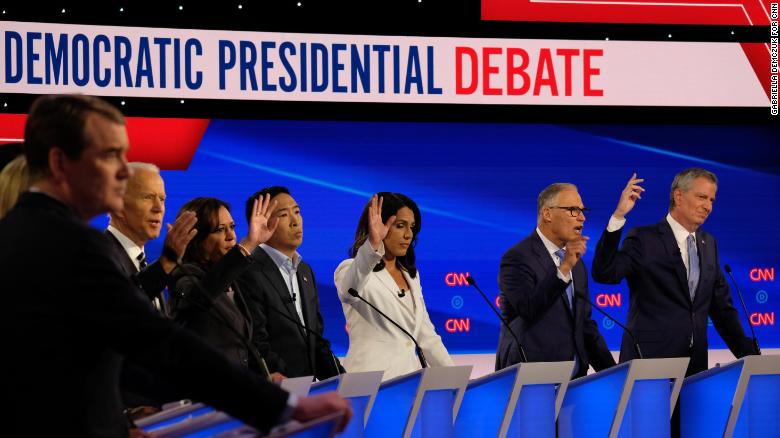 Presidential candidates Michael Bennet, Kirsten Gillibrand, Julián Castro, Cory Booker, Joe Biden, Kamala Harris, Andrew Yang, Tulsi Gabbard, Jay Inslee and Bill de Blasio participate in the CNN Democratic debate in Detroit on Wednesday, July 31.