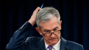 WASHINGTON, July 31, 2019 (Xinhua) -- U.S. Federal Reserve Chairman Jerome Powell reacts during a press conference in Washington D.C., the United States, on July 31, 2019. U.S. Federal Reserve on Wednesday lowered interest rates for the first time since the 2008 global financial crisis, amid rising concerns over trade tensions, a slowing global economy and muted inflation pressures. The Federal Open Market Committee, the Fed&#39;s rate-setting body, trimmed the target for the federal funds rate by 25 basis points to a range of 2 percent to 2.25 percent after concluding its two-day policy meeting, in line with market expectation.(Photo by Liu Jie/Xinhua via Getty) (Xinhua/Liu Jie via Getty Images)