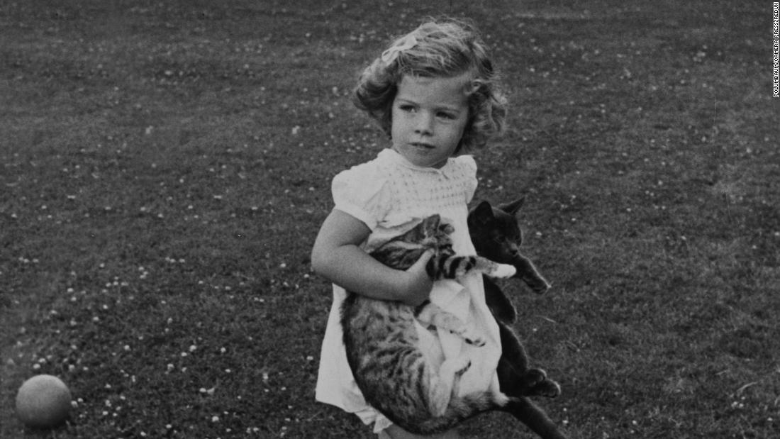 Caroline holds cats in the gardens of Hyannis Port in 1961.