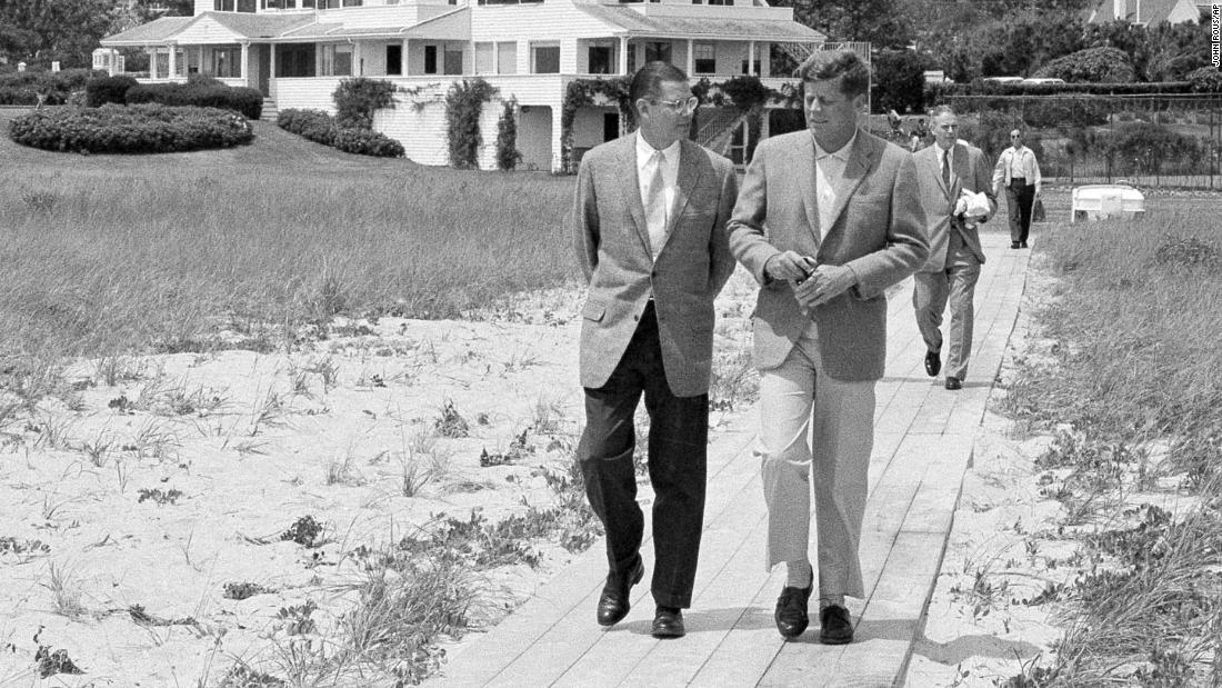 President Kennedy, right, walks with Defense Secretary Robert McNamara in 1961.