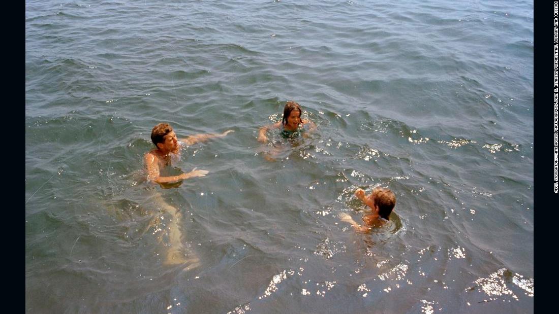 President Kennedy, left, swims with family and friends during a weekend in Hyannis Port in 1963.