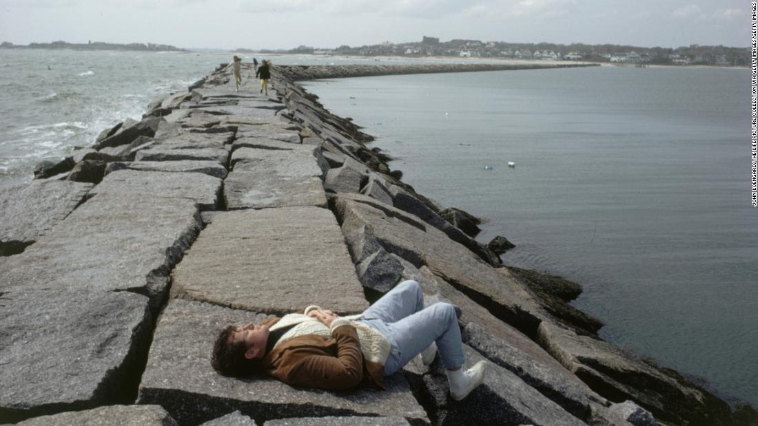 Ted Kennedy soaks up the sun on a Hyannis Port breakwater in 1969. He became a US senator in 1962, and he held that office until his death in 2009.