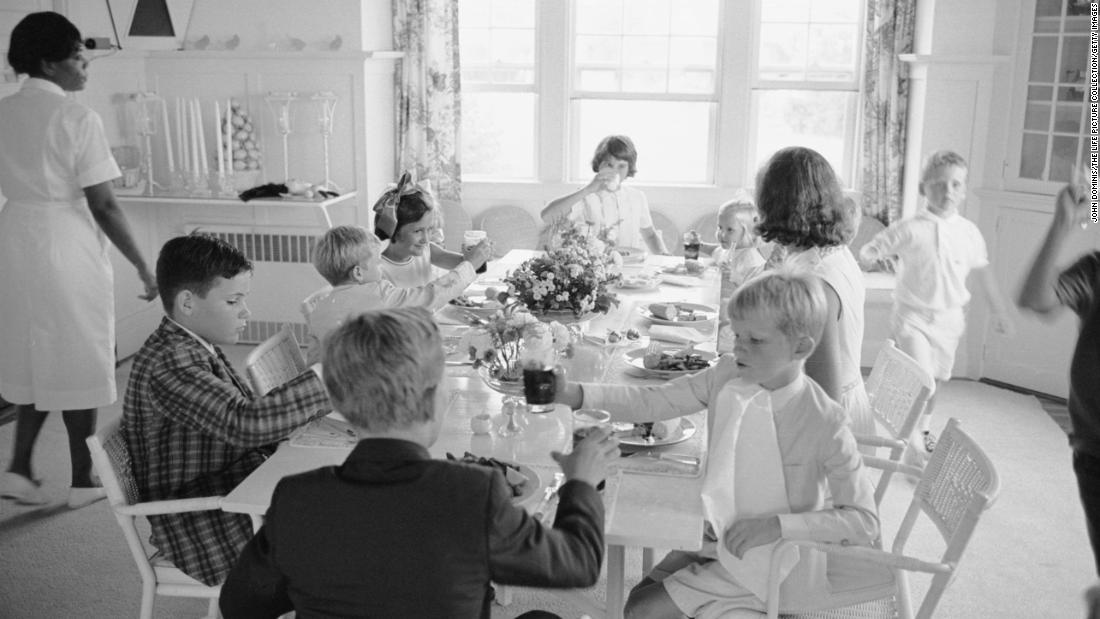 Ethel Kennedy sits with various Kennedy children in 1963, when the family was celebrating the christening of Bobby&#39;s son Chris.