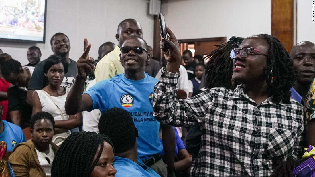 The overflowing courtroom sang Uganda's national anthem while they waited for the magistrate to arrive.