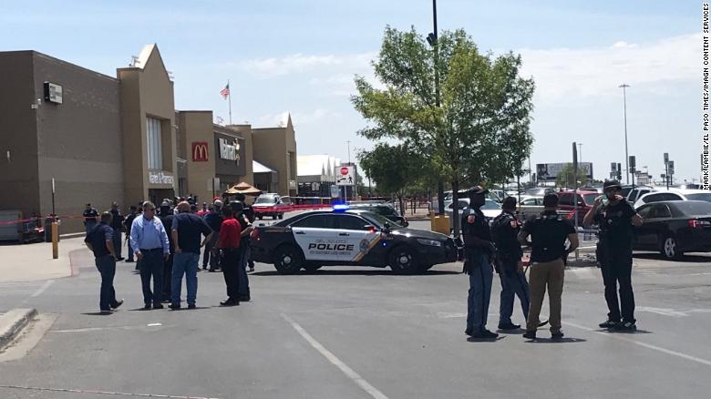 Police gather outside the Walmart at Cielo Vista Mall where an active shooter was reported.