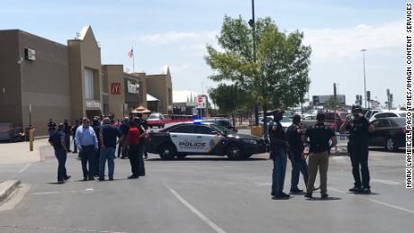 Police gather outside the Walmart at Cielo Vista Mall.