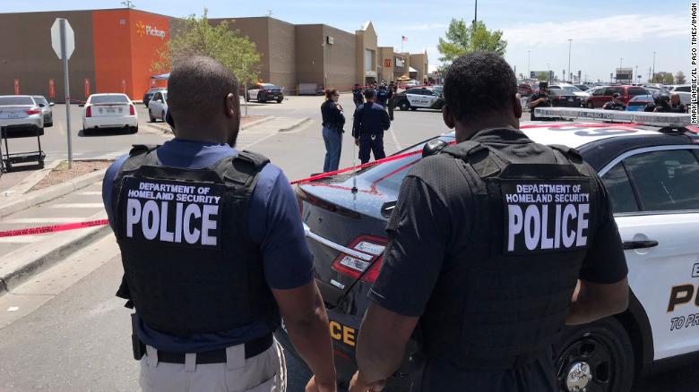 Police investigate near the scene of the shooting at the Walmart in El Paso, Texas, on Saturday, August 3.