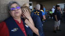 Walmart employees react after a shooter opened fire in El Paso, Texas, on Saturday, August 3.