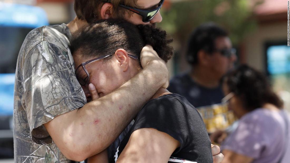 Kendall Long comforts Kianna Long, who was in the freezer section of the El Paso Walmart during the shooting.