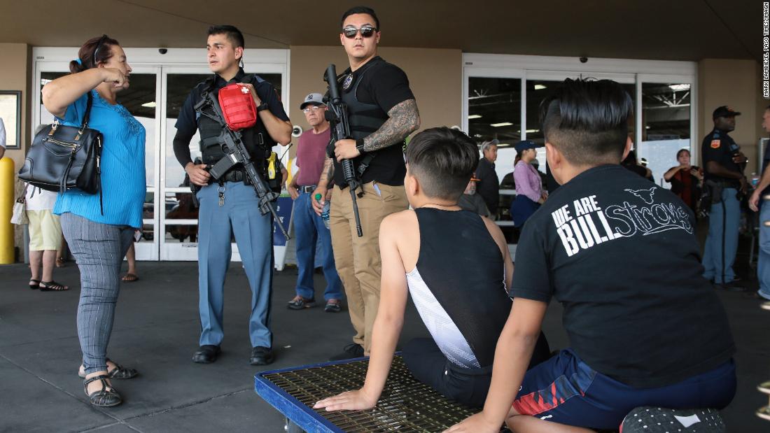 Police speak to witnesses at a nearby Sam's Club in El Paso.