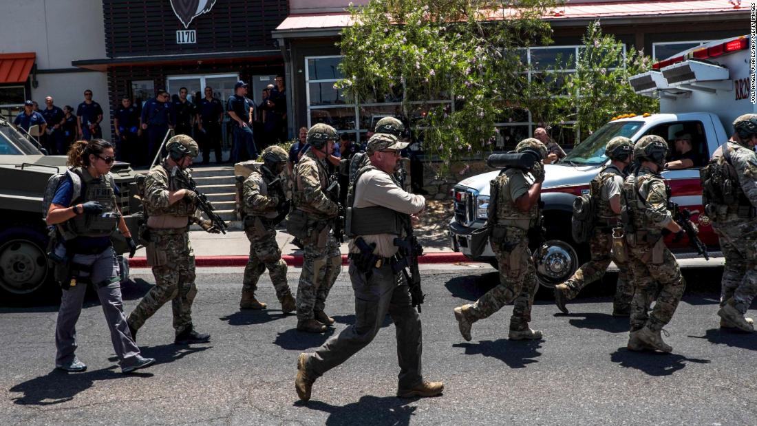 Members of law enforcement respond to an active shooter at a Walmart near Cielo Vista Mall.