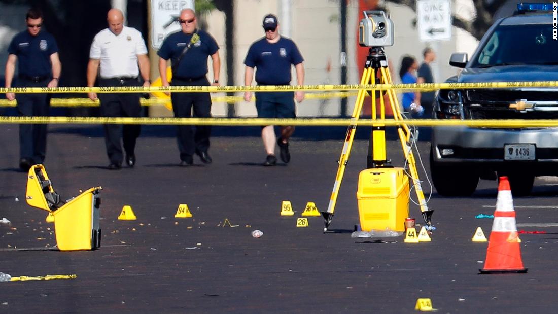 Evidence markers sit in a Dayton street on Sunday.