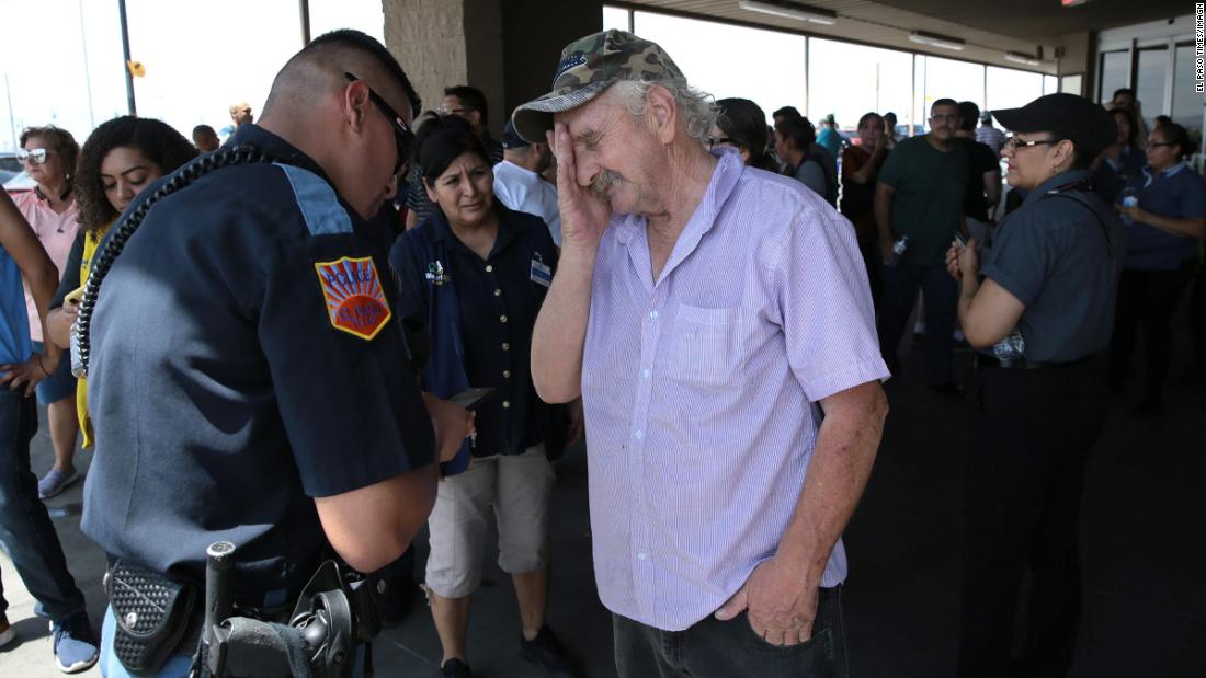 An El Paso police officer interviews a witness after the shooting.