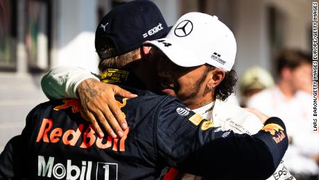 Lewis Hamilton and Max Verstappen embrace following their thrilling battle.