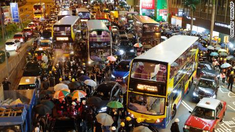 Vehicles are stuck on the roads as protesters use barricades to block several roads at Causeway Bay to hold the anti-extradition bill protest in Hong Kong, August 4, 2019. 