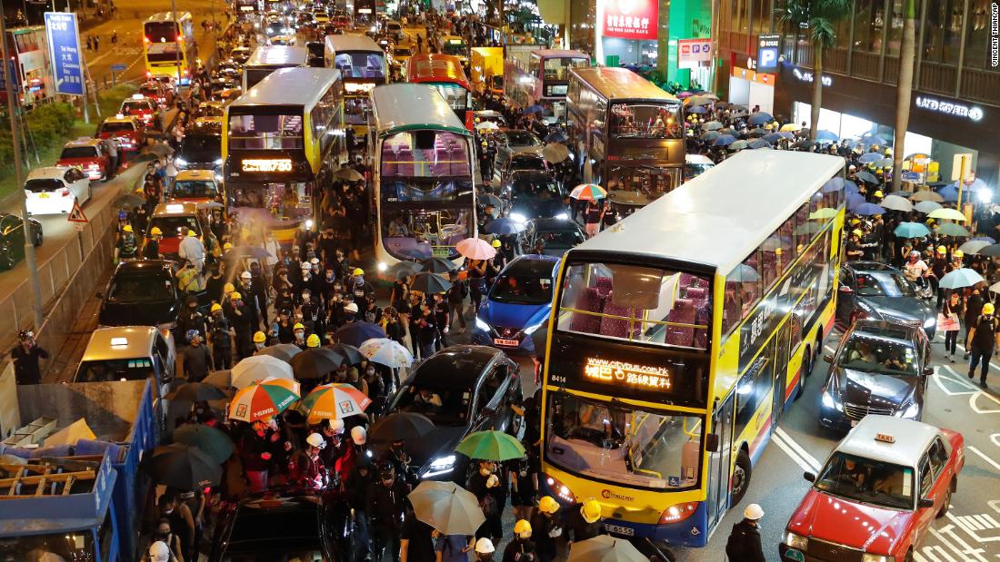 Vehicles are stuck on the roads as protesters use barricades to block several roads at Causeway Bay to hold the anti-extradition bill protest in Hong Kong, August 4, 2019. 