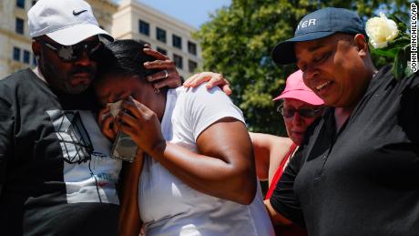 Mourners gather at a vigil following the mass shooting in Dayton.