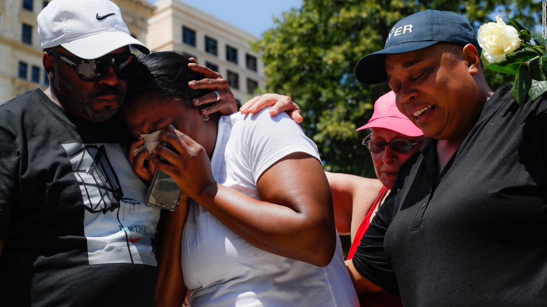 Mourners gather at a vigil in Dayton.