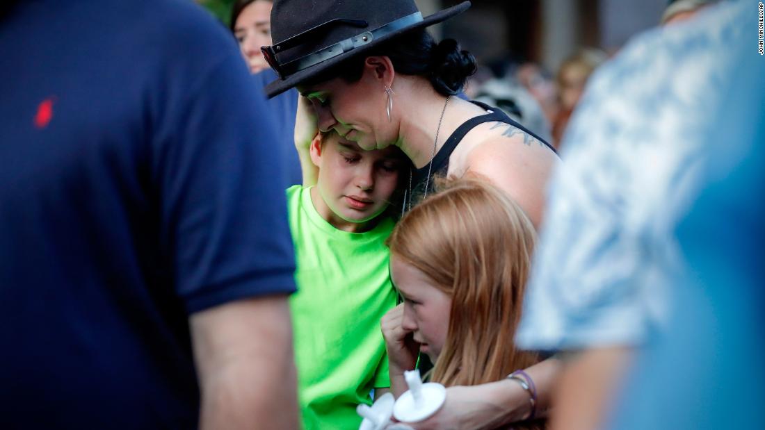 Mourners gather at Sunday's vigil in Dayton.