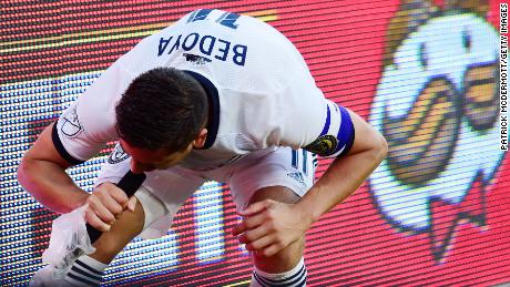 Alejandro Bedoya yells into a television microphone after scoring a goal.