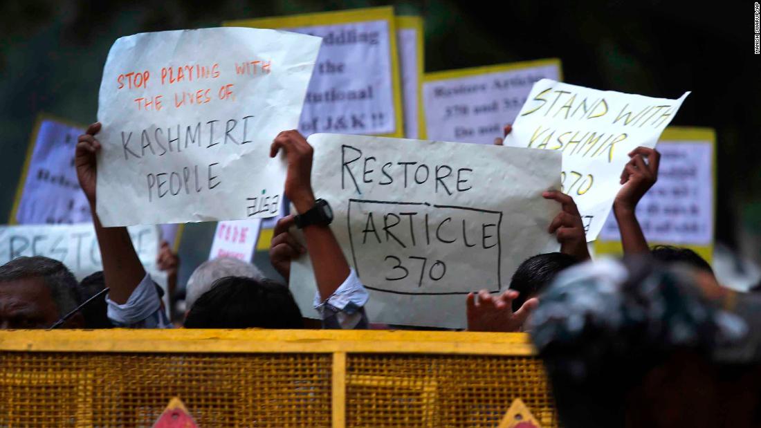 Left party supporters and students hold placards during a protest against the Indian government revoking Kashmir's special constitutional status in New Delhi, India on Monday. 